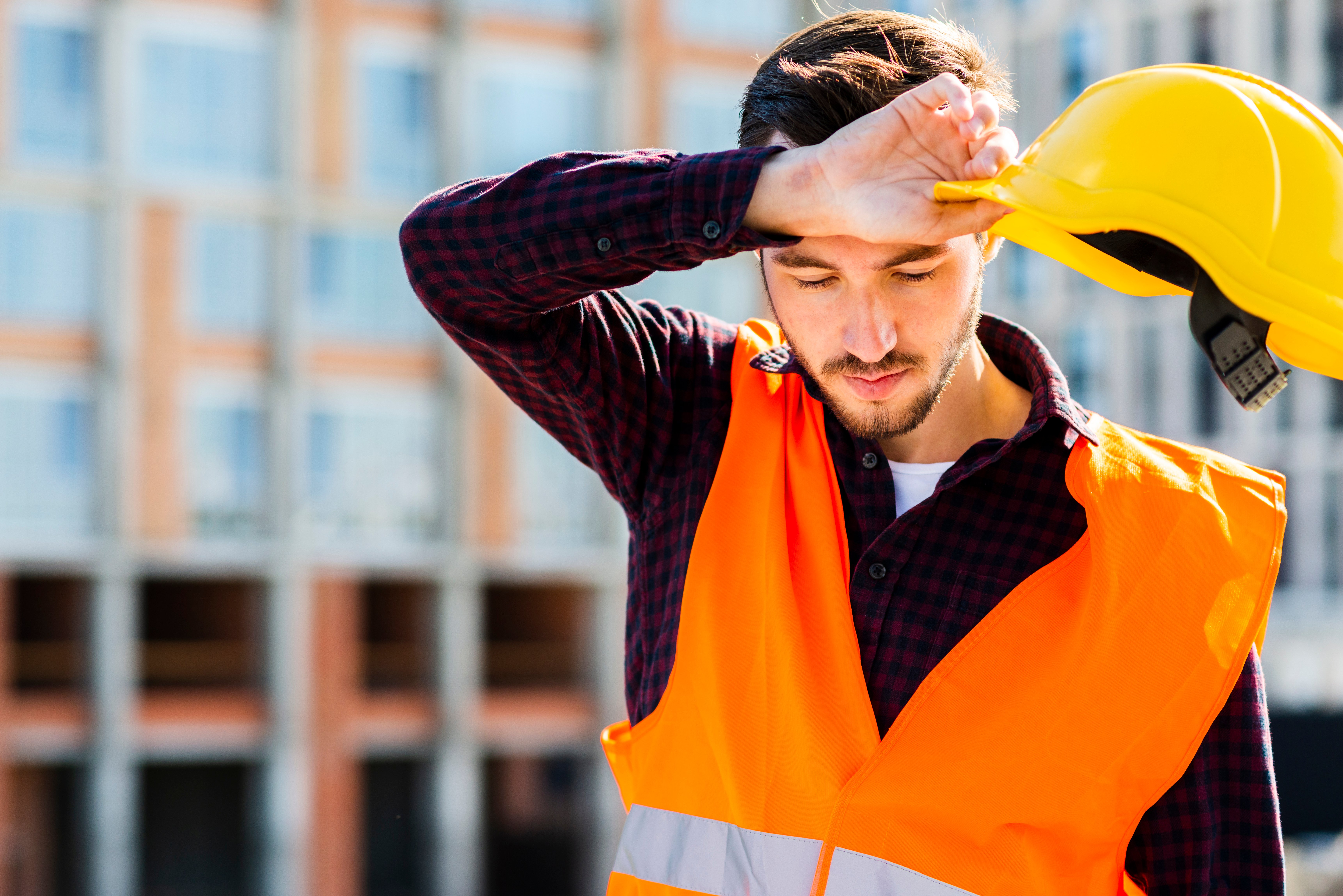 Medium shot portrait of tired construction worker