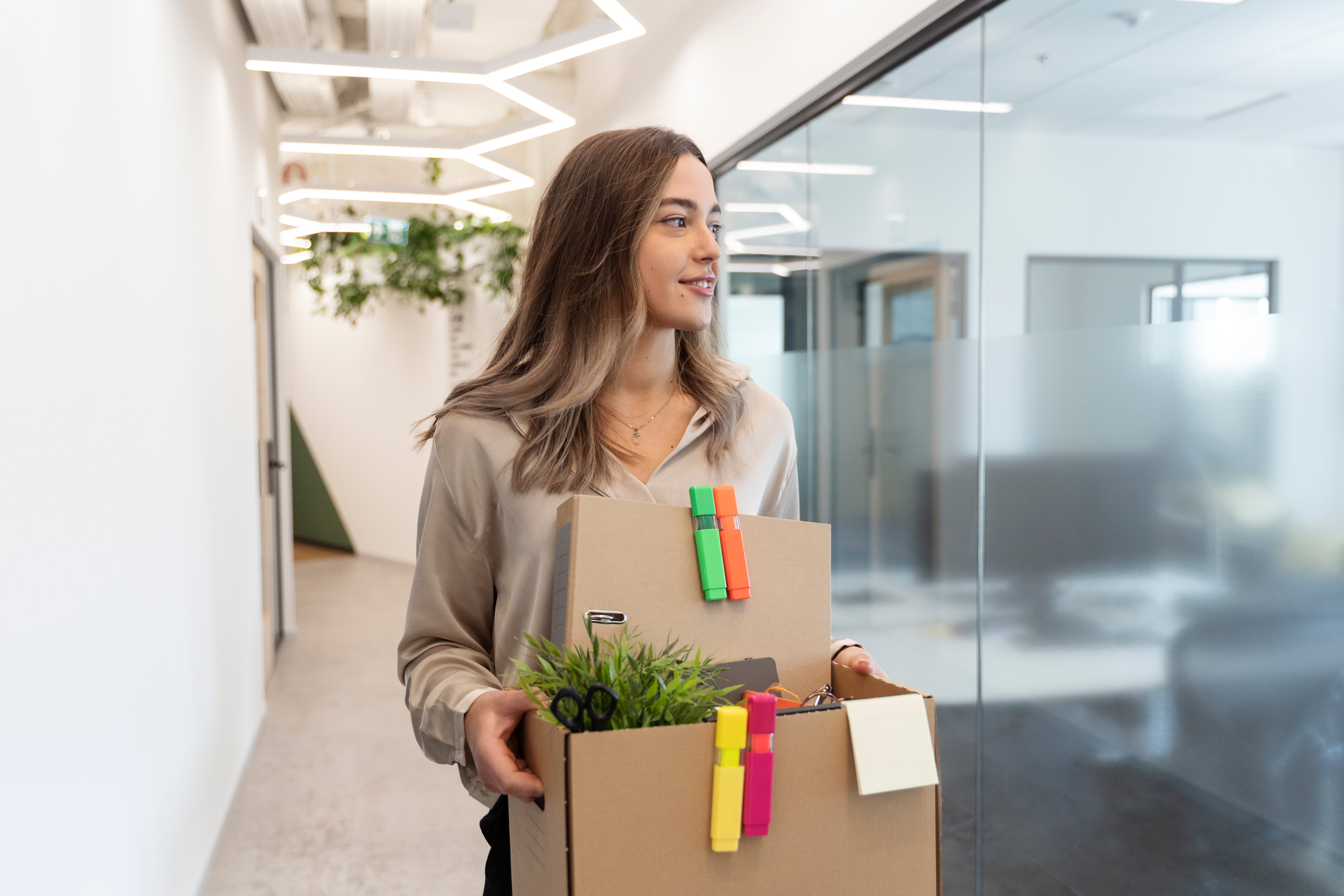 Medium shot woman with cardboard box